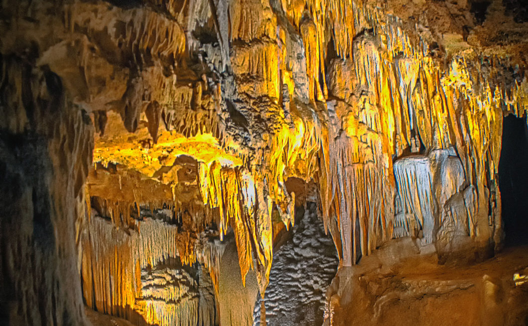 image of a cave filled with stalactites
